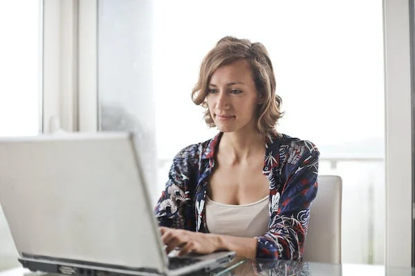 a woman using a laptop